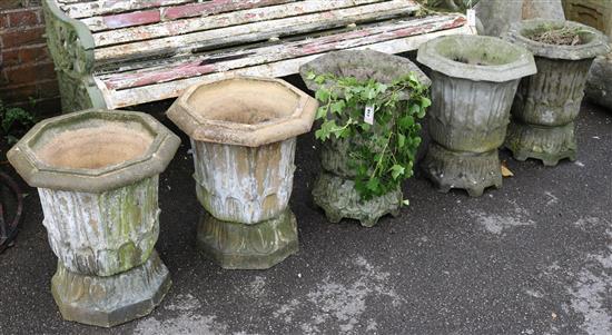 A pair of small reconstituted campana shaped urns & 3 others